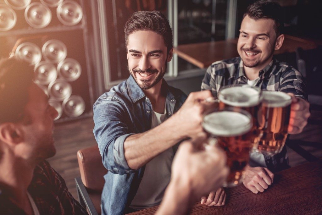 men having drinks in a bar
