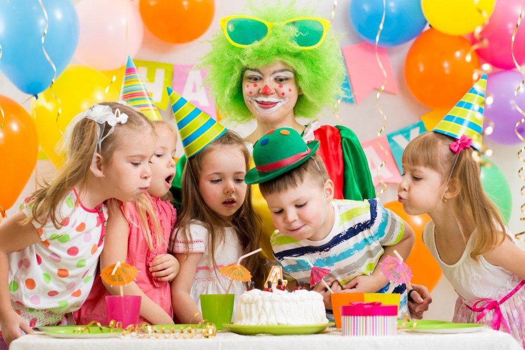 Children's birthday party celebration with birthday cake